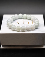 White beaded Jade bracelet on a white Jade Jewelers box