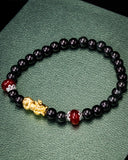 Small Gold Dragon Black Bead Jade Bracelet